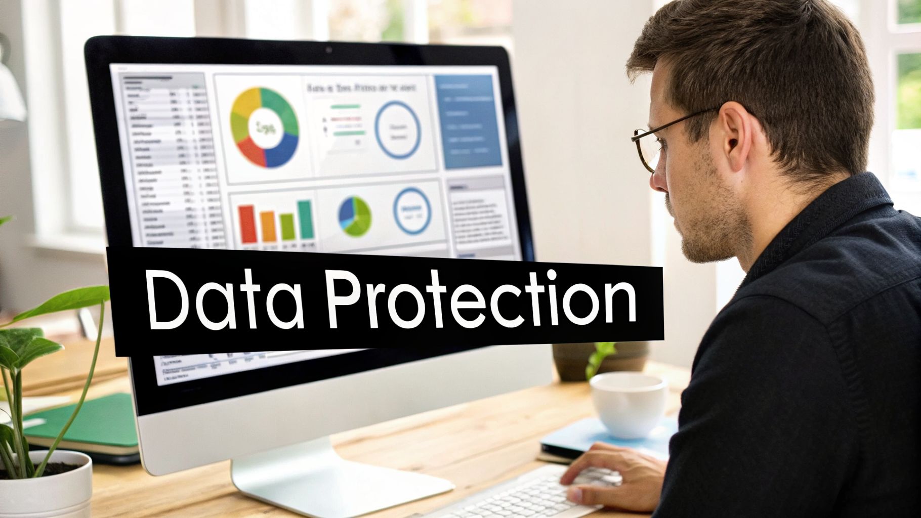 A man in glasses reviews data on a computer monitor with a 'Data Protection' overlay.